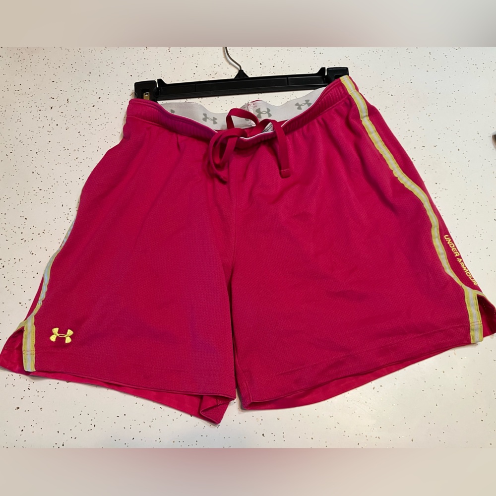 Under Armour athletic shorts, pink with yellow stripe, size small